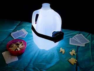 a gallon jug of water with a headlamp to make a diy lantern for camping