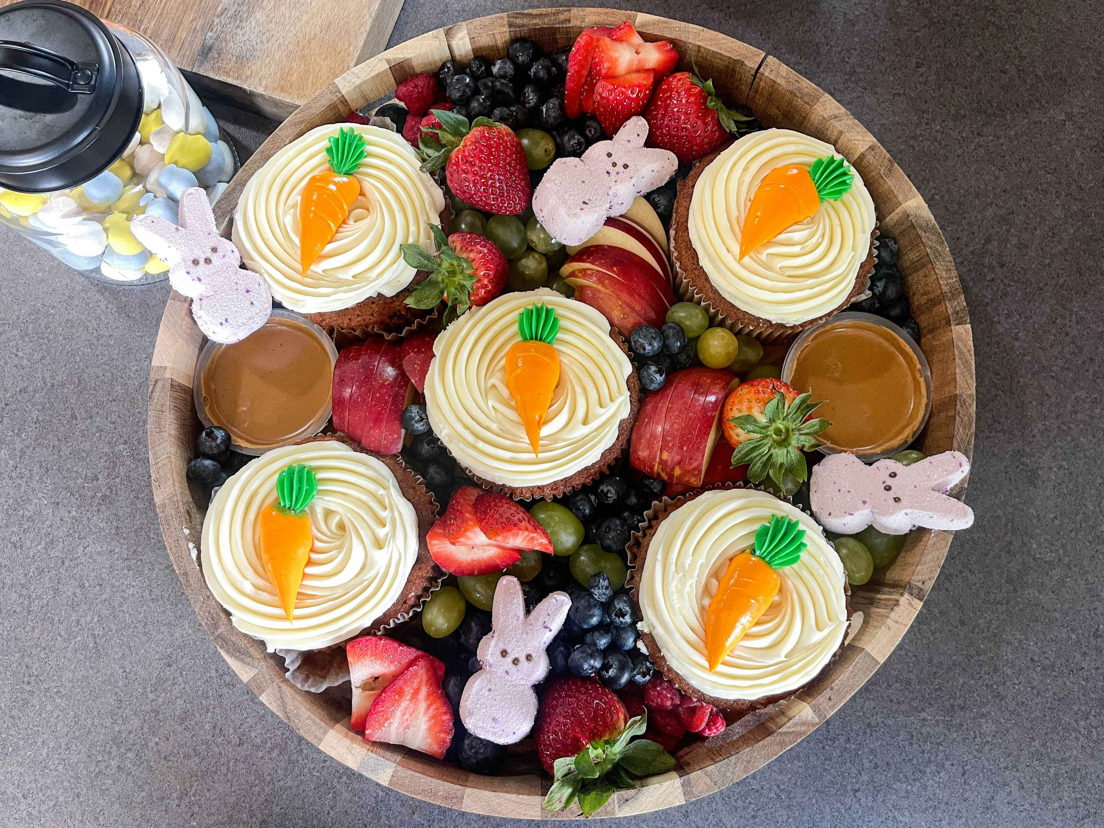 carrot cake cupcakes put into a fruit and easter board 