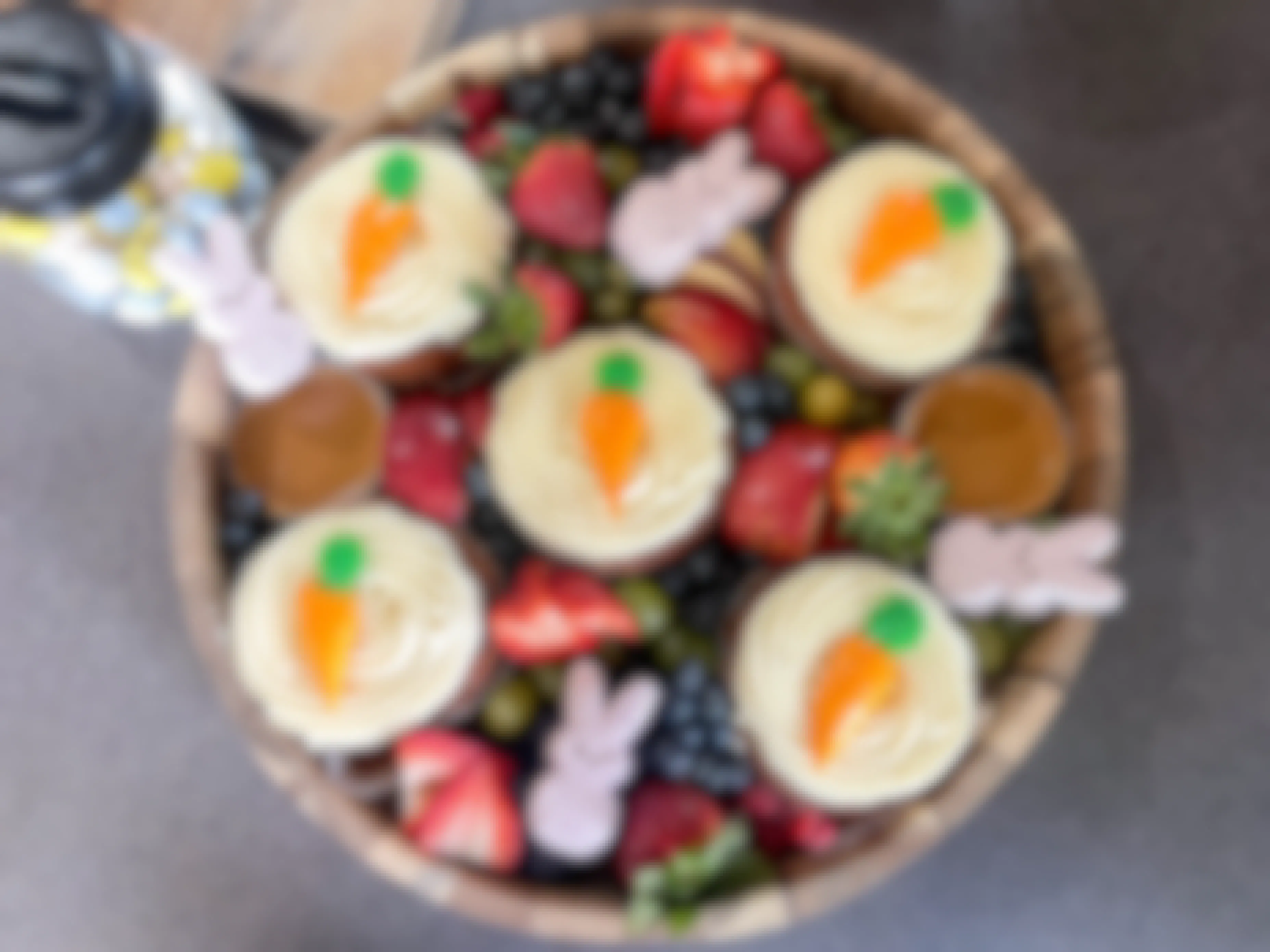 carrot cake cupcakes put into a fruit and easter board 