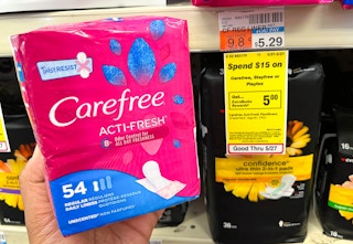 hand holding pack of Carefree liners next to sales tag