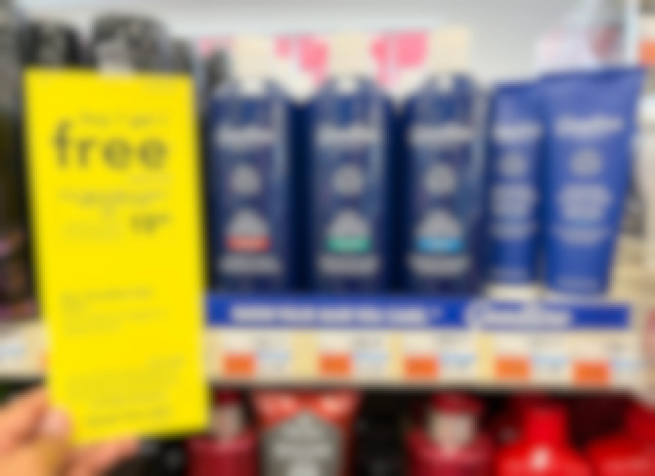 hand holding up sales tag sign next to Goodline hair care display