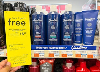 hand holding up sales tag sign next to Goodline hair care display