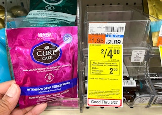 hand holding Hask hair mask satchet next to sales tag