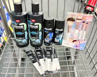 two Axe body washes, two Axe body sprays, one Joah Take Me With you Brush kit, and three Covergirl eye pencils inside cart