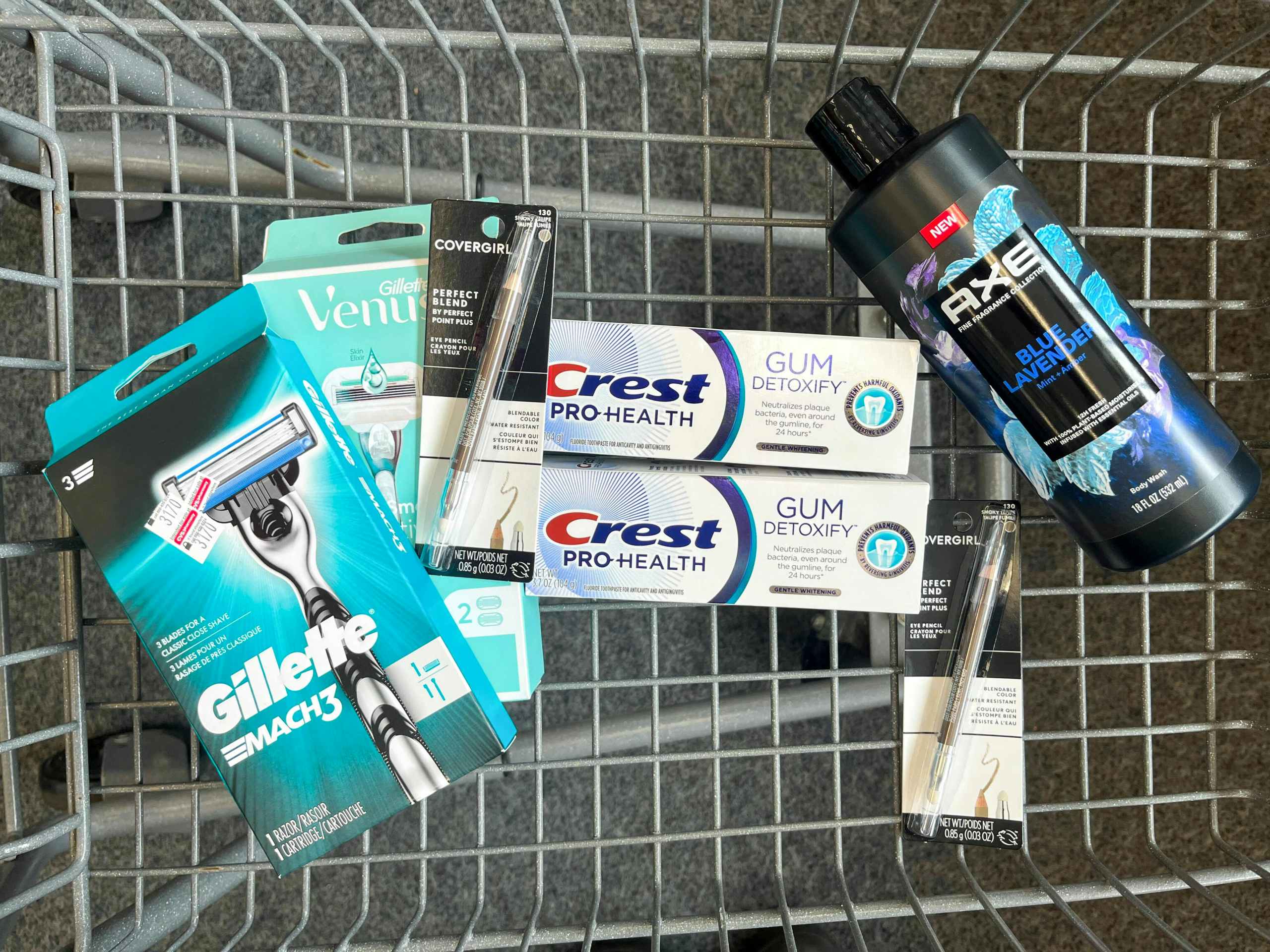 shopping cart with Gillette Mach3 razor, Gillette Venus Smooth razor, Crest Detoxify toothpaste, Covergirl eyeliners, and Axe body wash inside