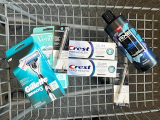 shopping cart with Gillette Mach3 razor, Gillette Venus Smooth razor, Crest Detoxify toothpaste, Covergirl eyeliners, and Axe body wash inside