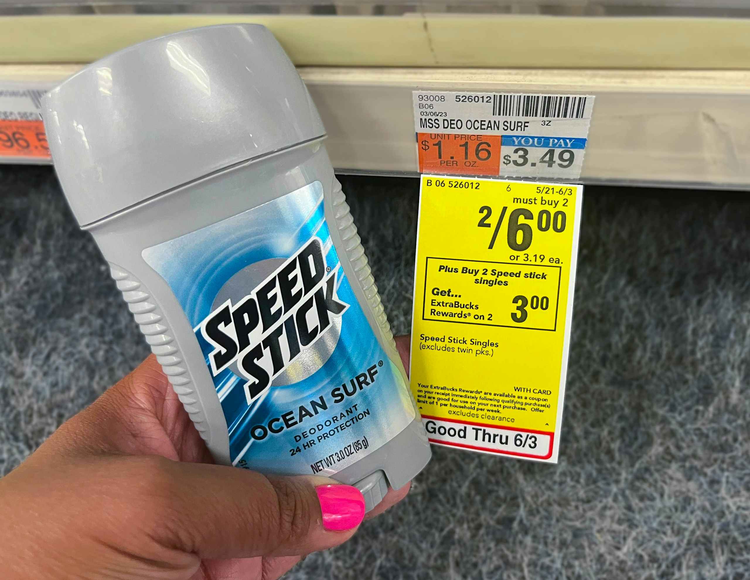 hand holding one speed stick deodorant next to sales tag
