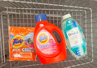 one bottle of Tide liquid detergent, Downy Rinse and Refresh, and one pack of Tide pods inside shopping cart