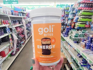 hand holding a bottle of goli energy bites