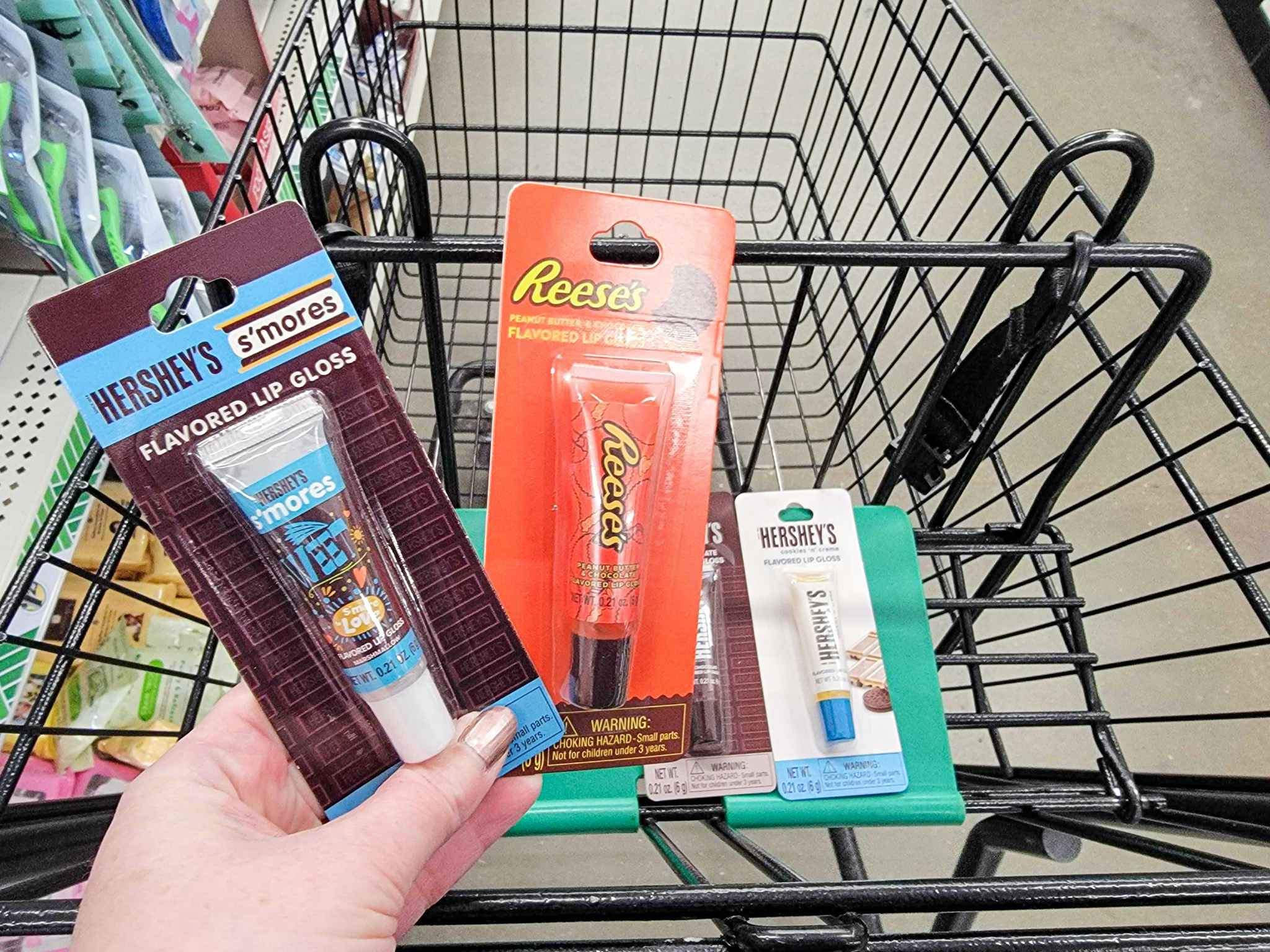 hersheys & reeses flavored lip glosses over a cart