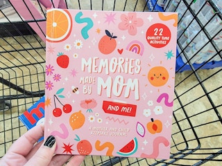 hand holding a mothers day gift book