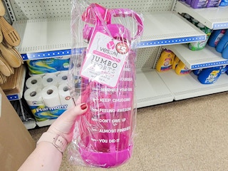 hand holding a pink motivational water bottle