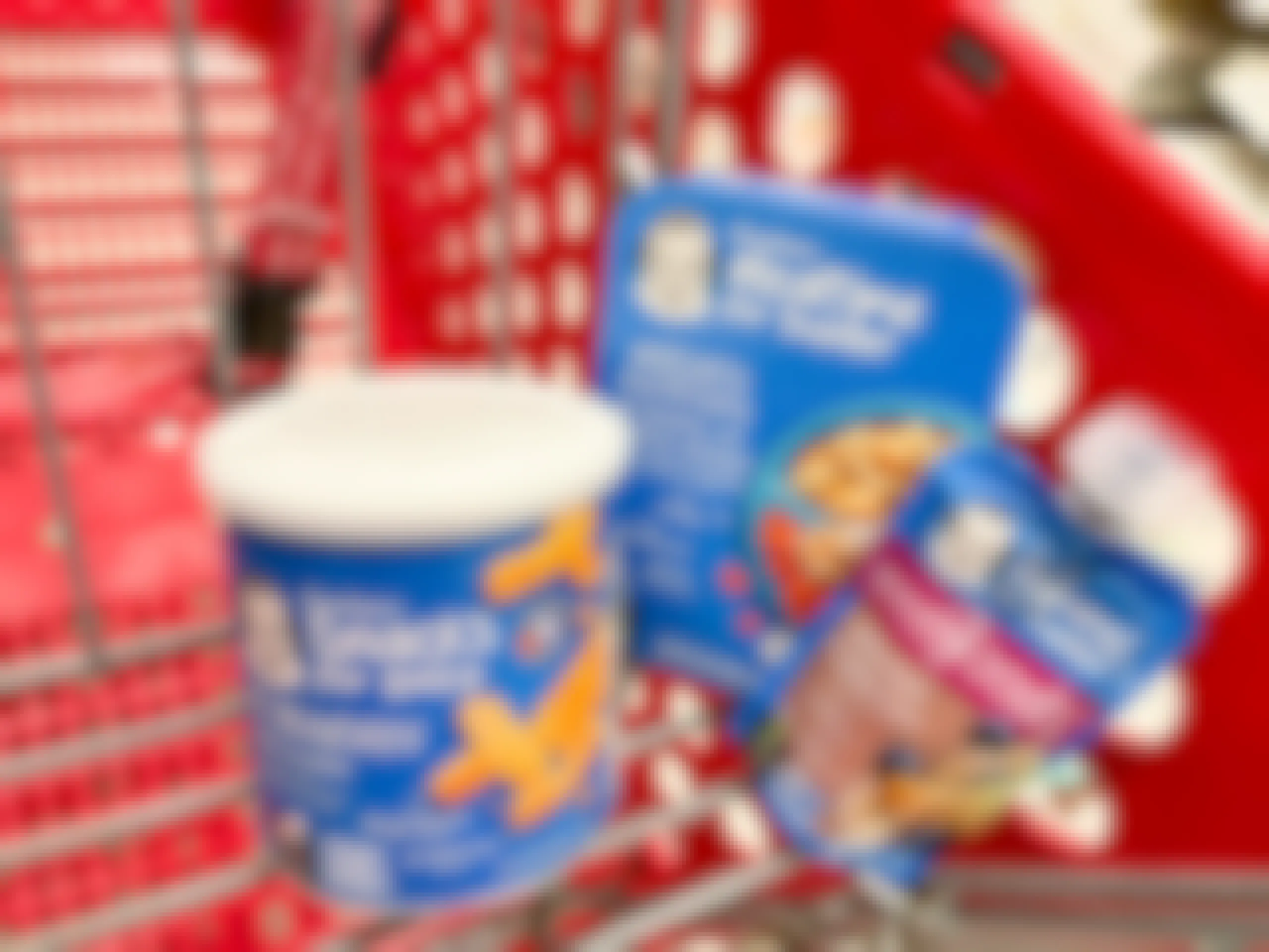 A variety of Gerber baby food sitting in a store cart.