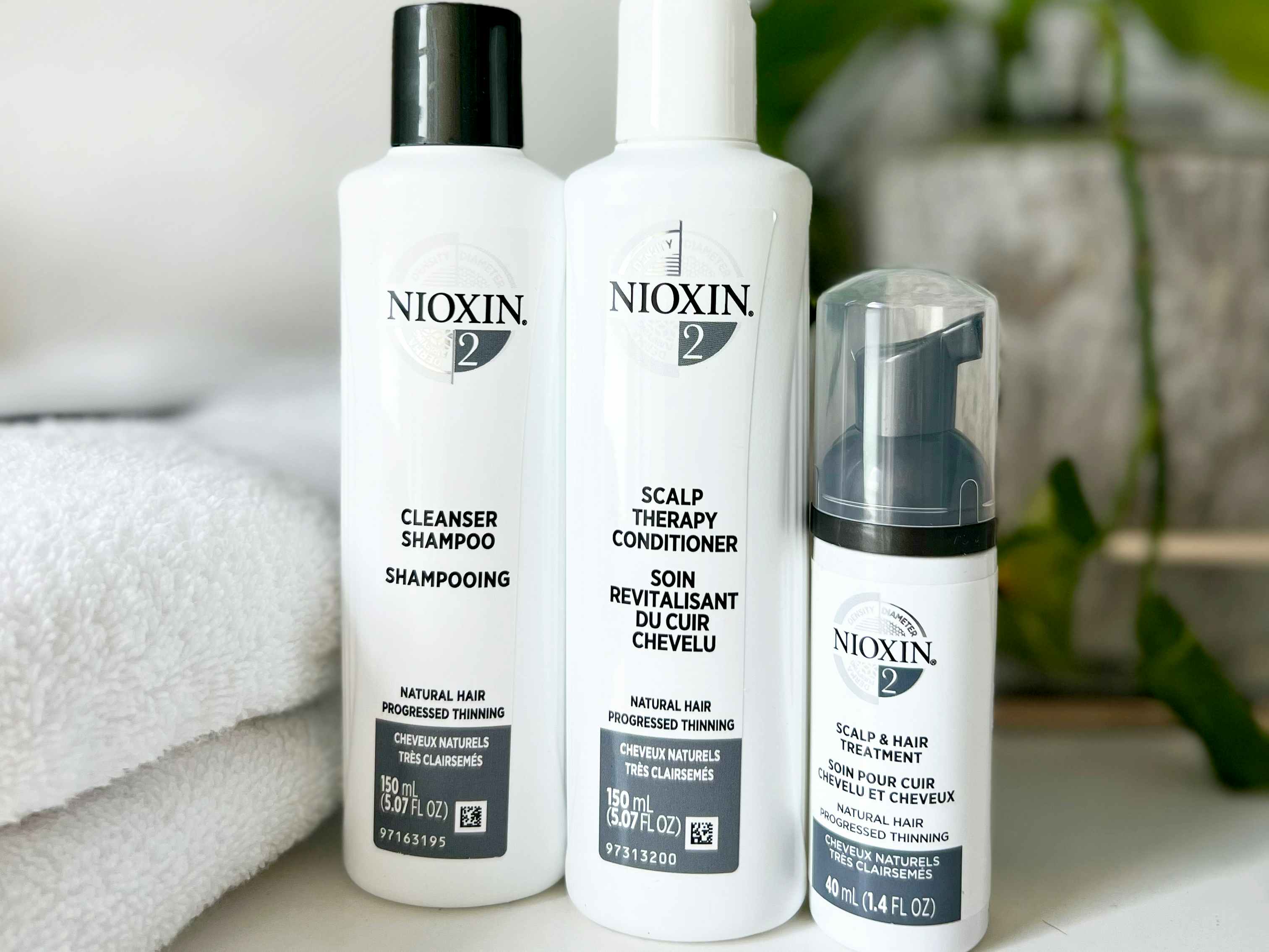 Nioxin hair products sitting on a bathroom countertop