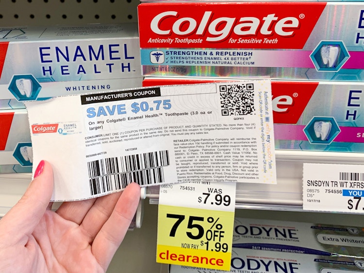 Someone holding a coupon next to a product on clearance at CVS