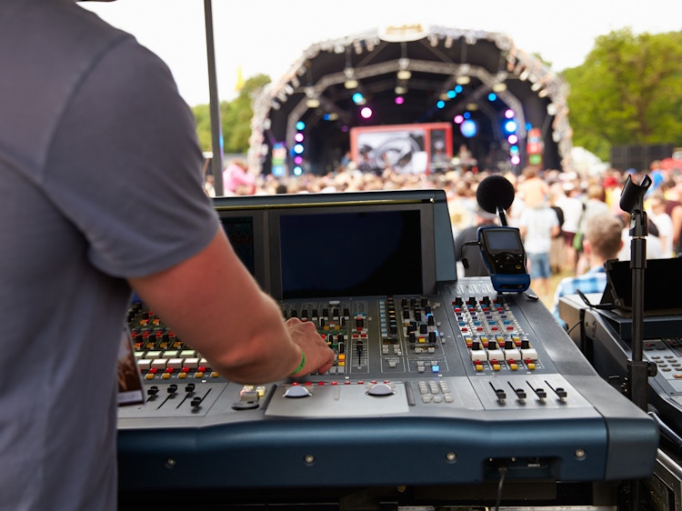Sound and lighting engineer at an outdoor festival concert