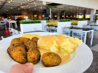 Someone holding a plate of food from Ikea