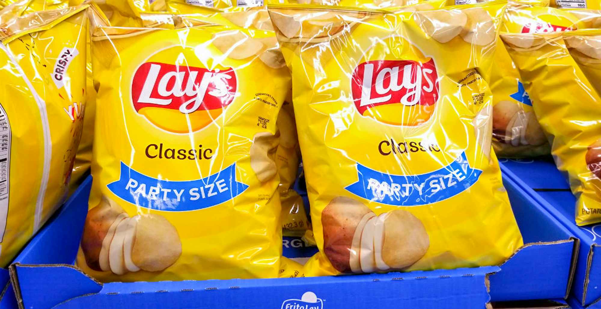 lays party size potato chips sitting on a shelf