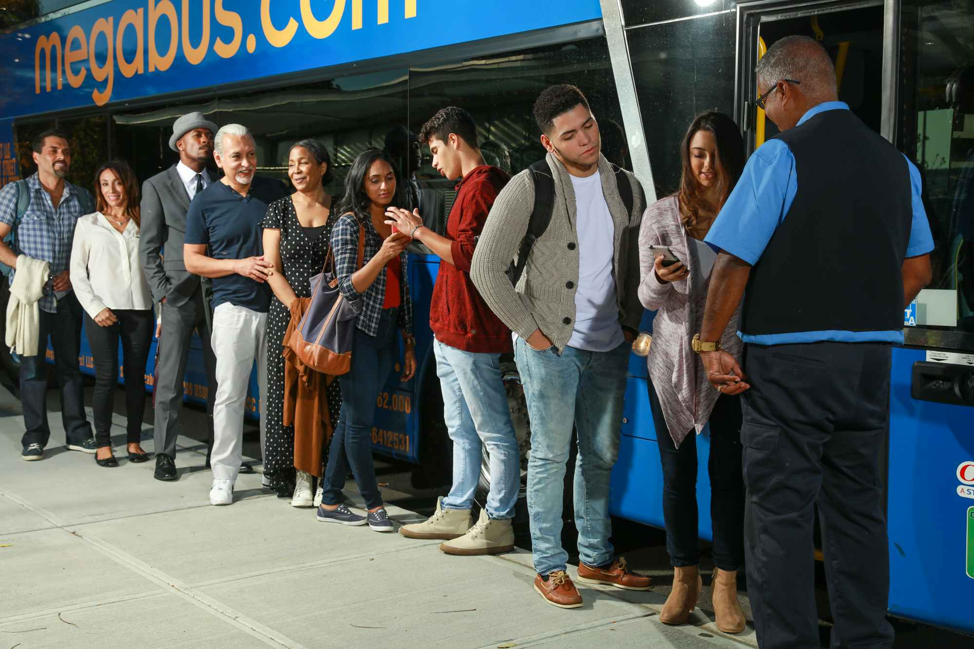 People standing in line to board a Megabus