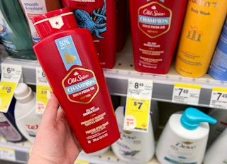 hand holding a bottle of old spice champion body wash