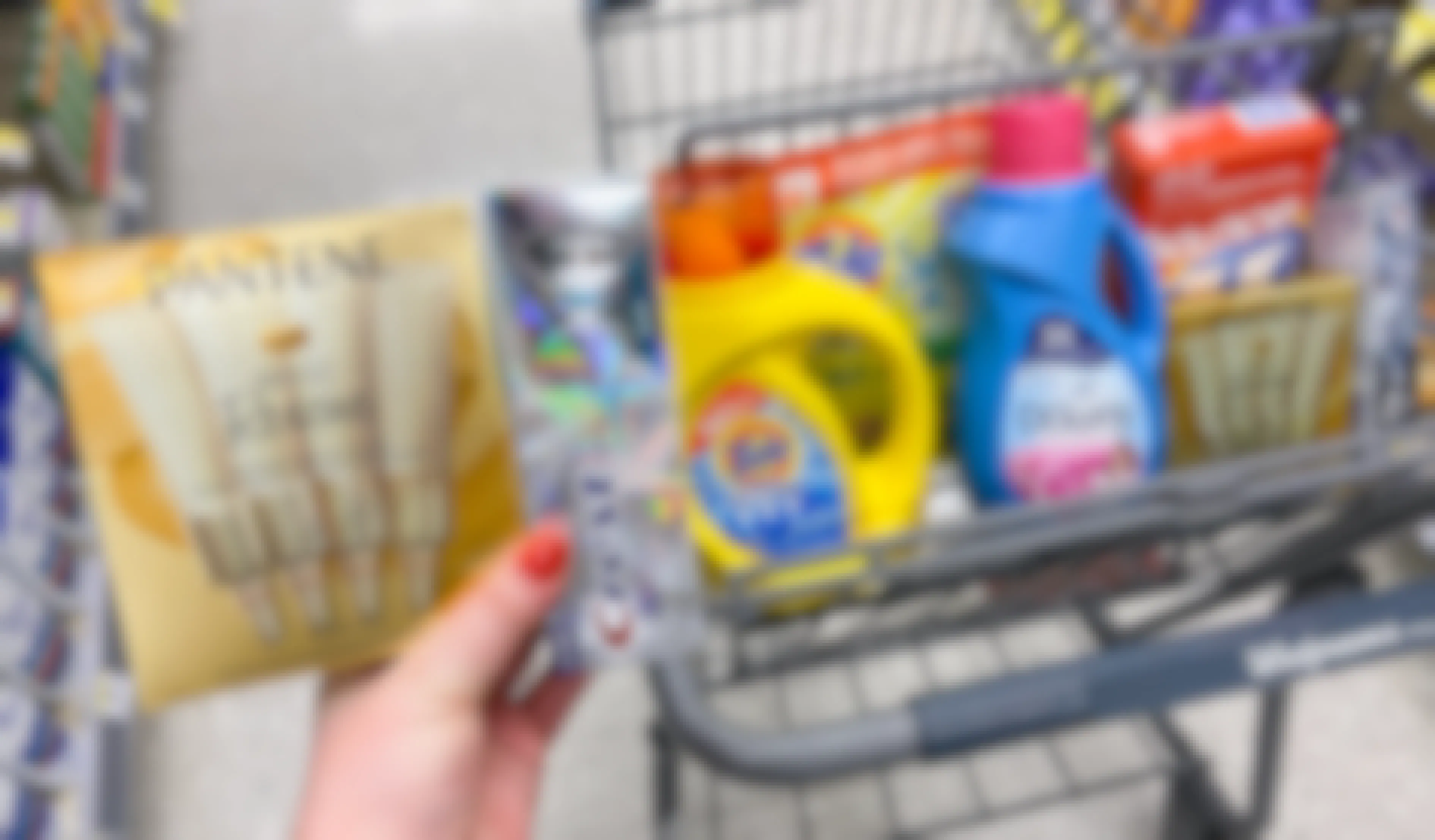 a walgreens cart with pantene, crest, tide, downy, and bounce