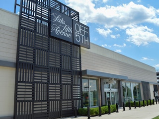 The exterior and sign of a Saks Fifth Avenue Off 5th store