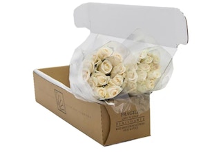 white roses in a box