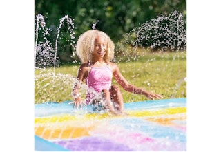 child playing on a splash pad