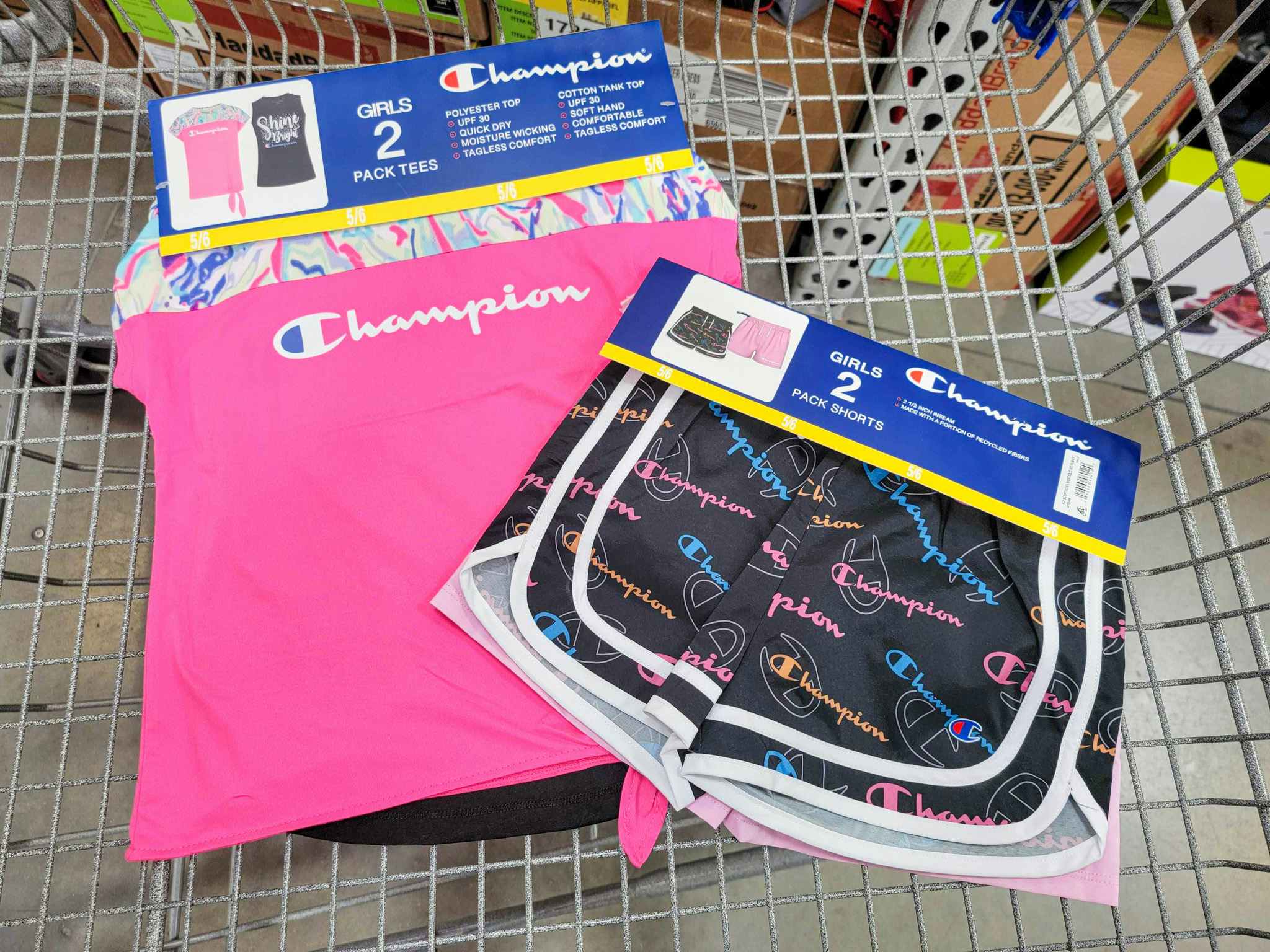 kids champion shirts and shorts in a cart