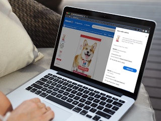 Someone looking at the prices on a bag of Science Diet dog food through third party sellers on Walmart