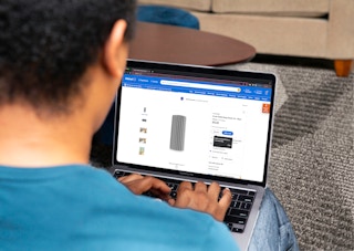 Person looking at the walmart webpage with the Scrub Daddy Damp Duster product