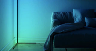 led floor lamp in the corner of a living room