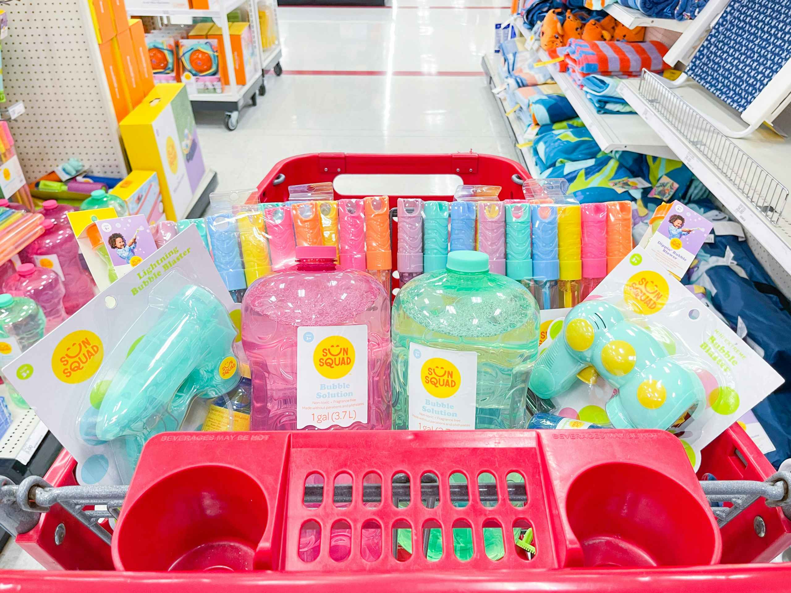A variety of bubble toys sitting in a store cart.