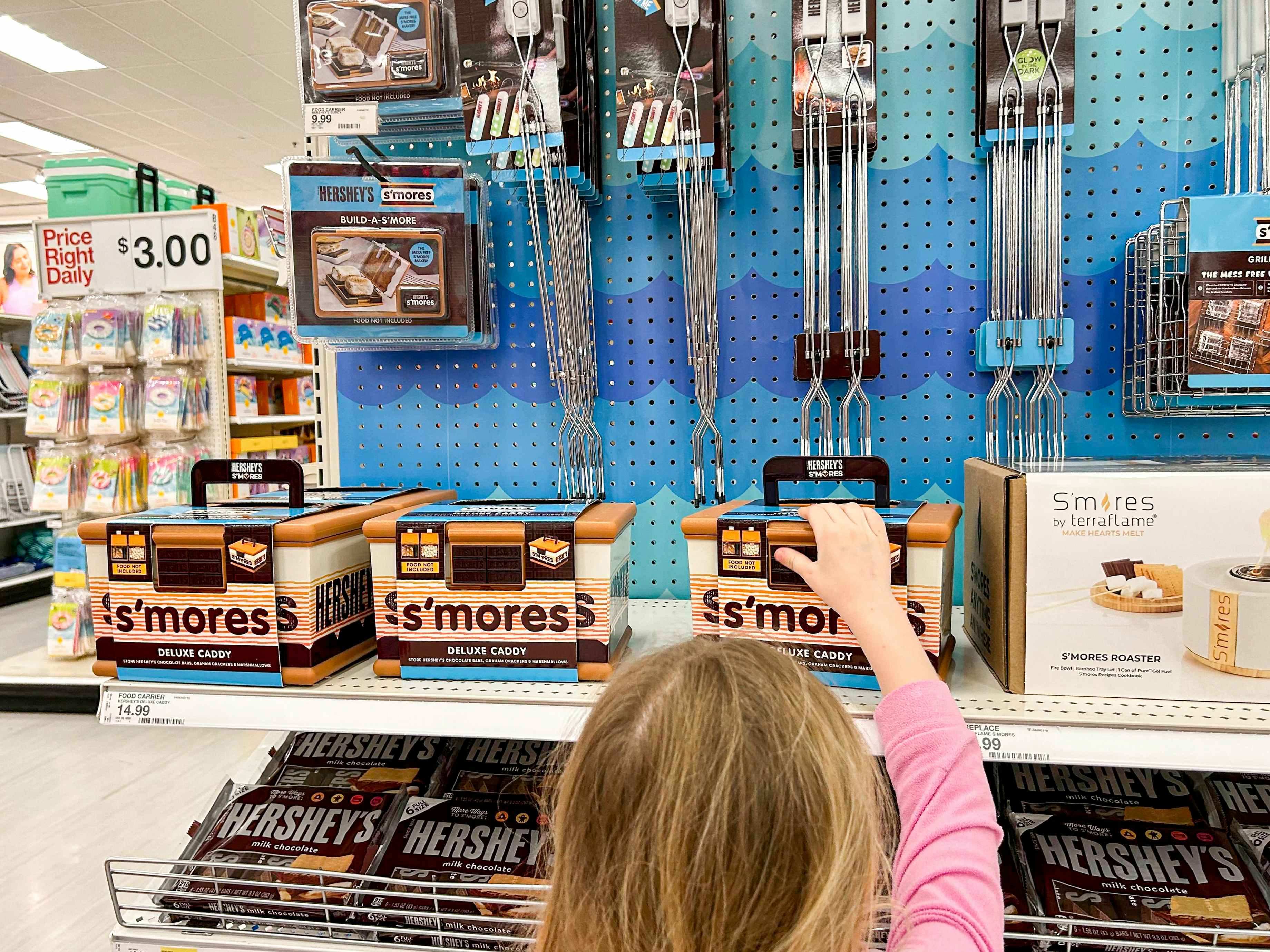 a child reaching for a s'mores caddy at target