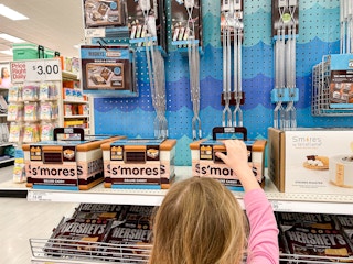 a child reaching for a s'mores caddy at target