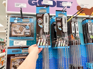 a person holding up a light up s'mores skewer at target