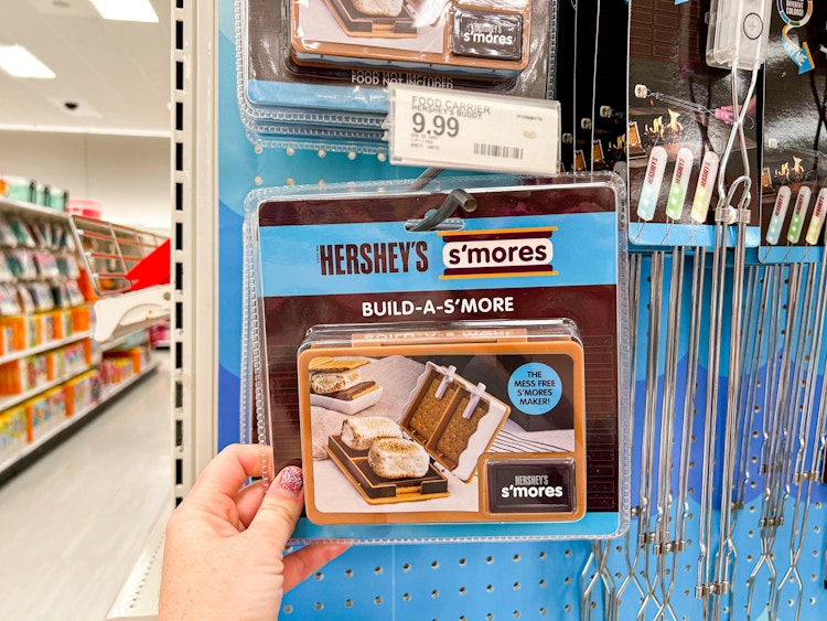 a person holding up a s'mores buddy in target