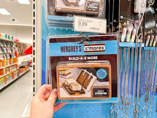 a person holding up a s'mores buddy in target