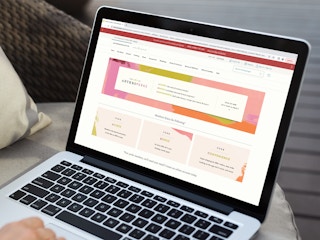 a person looking at anthro perks on their macbook