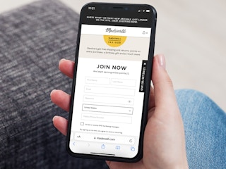 a person looking at the madewell insider program on their iphone