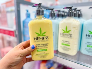 ulta hempz lotion yellow bottle held in hand 1685548164 1685548165