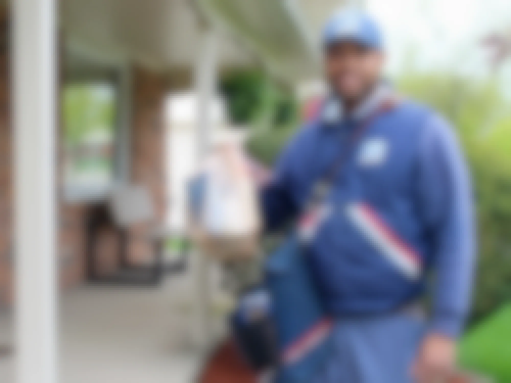 USPS employee during the Stamp Out Hunger day collecting food donations
