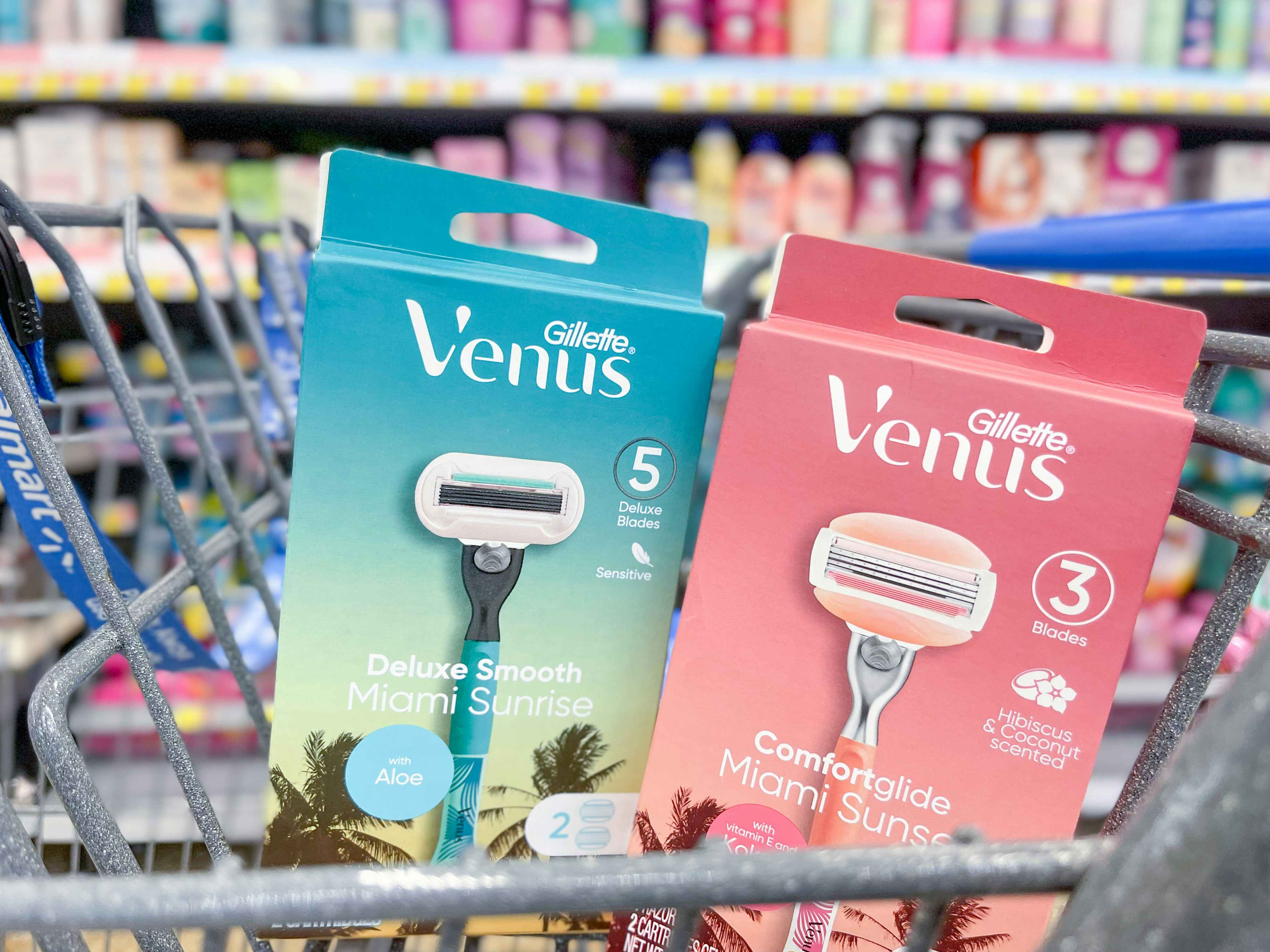 A box of Venus Miami Sunset and Venus Miami sunrise razors sitting in the front of a shopping cart.