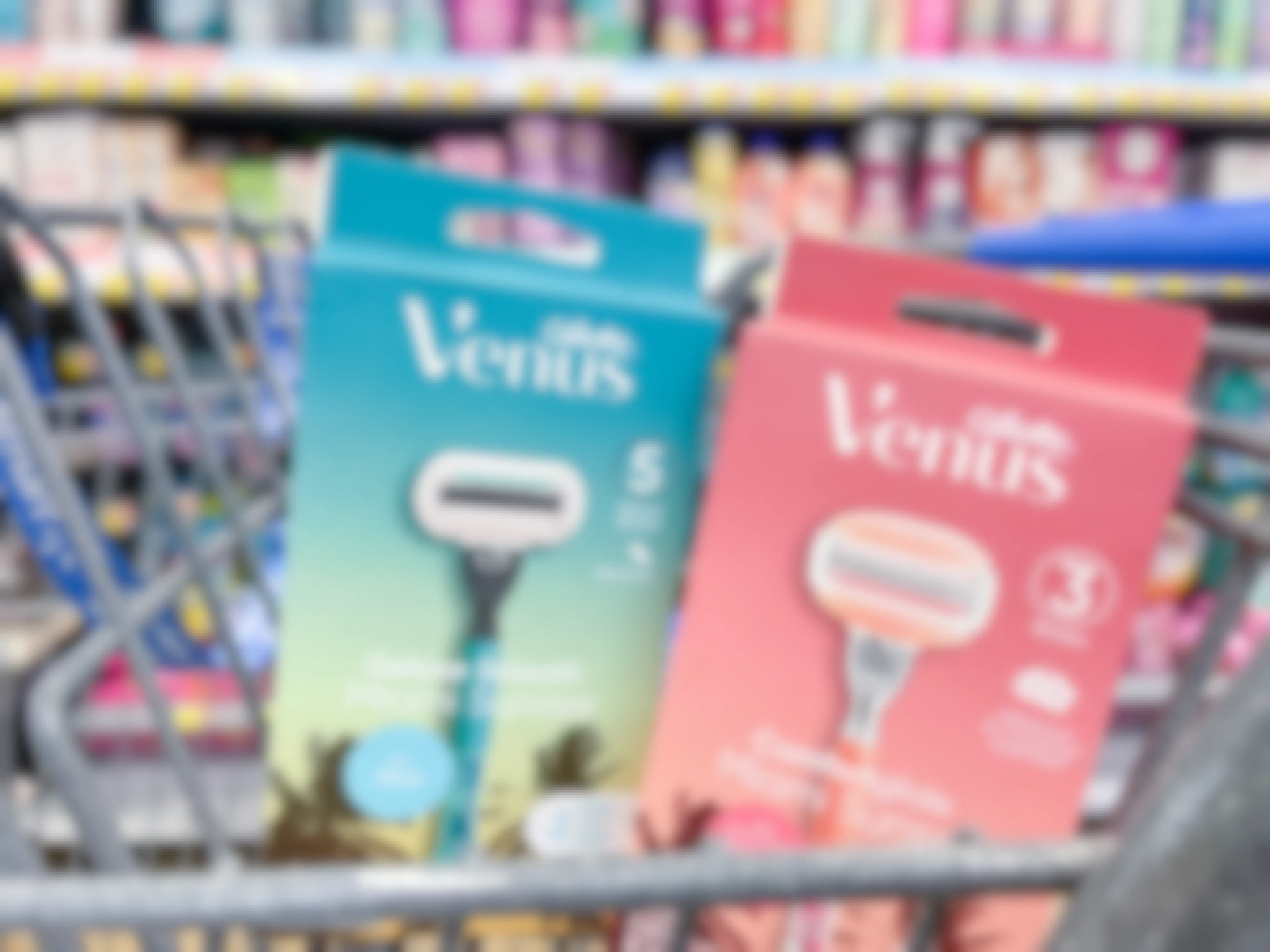 A box of Venus Miami Sunset and Venus Miami sunrise razors sitting in the front of a shopping cart.
