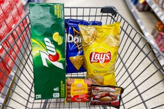 walgreens cart filled with food, lays chips, doritos, oscar mayer hot dogs, ball park franks, and 7up soda
