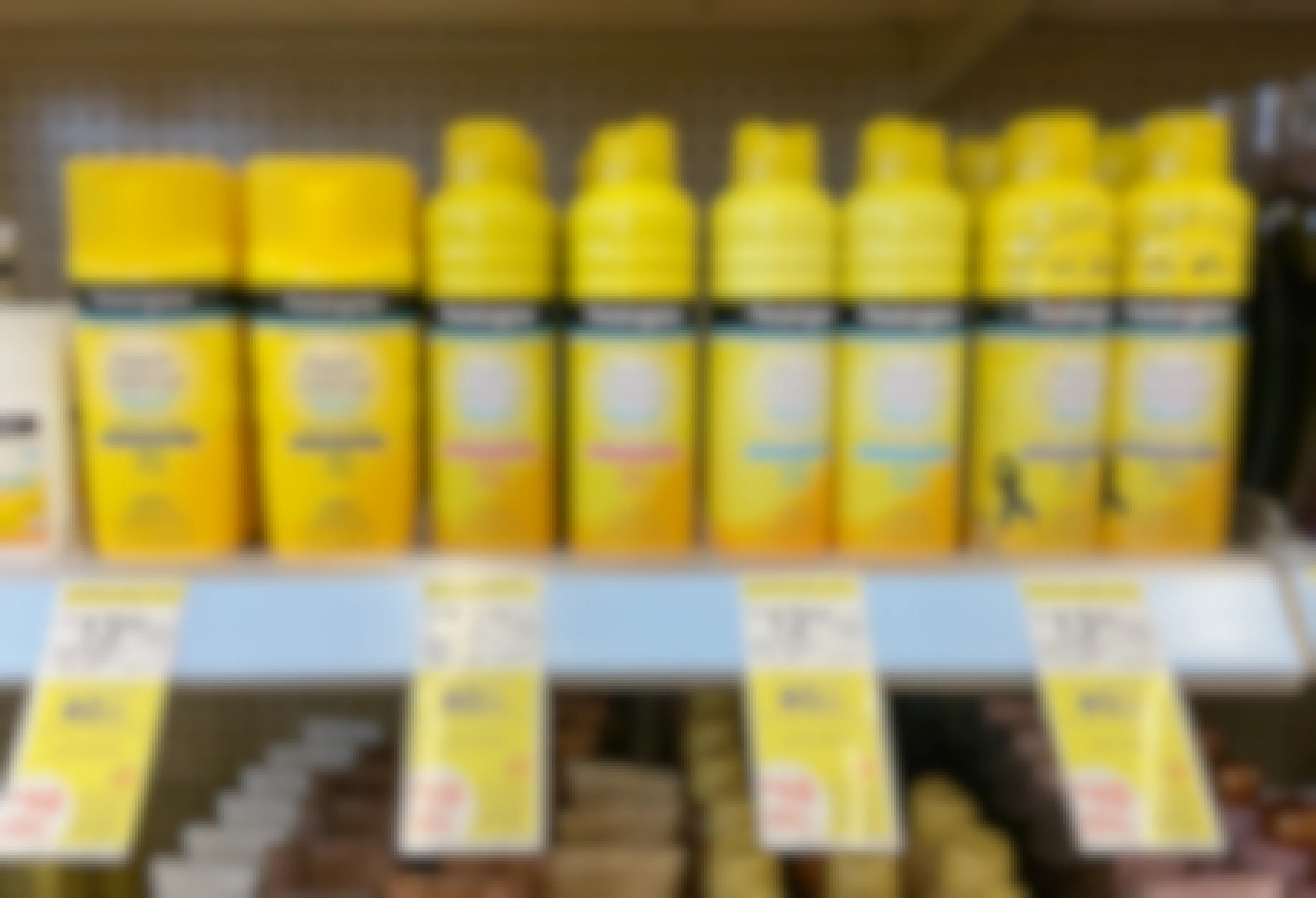 walgreens neutrogena sunscreen beach defense spray on a shelf with sale tags