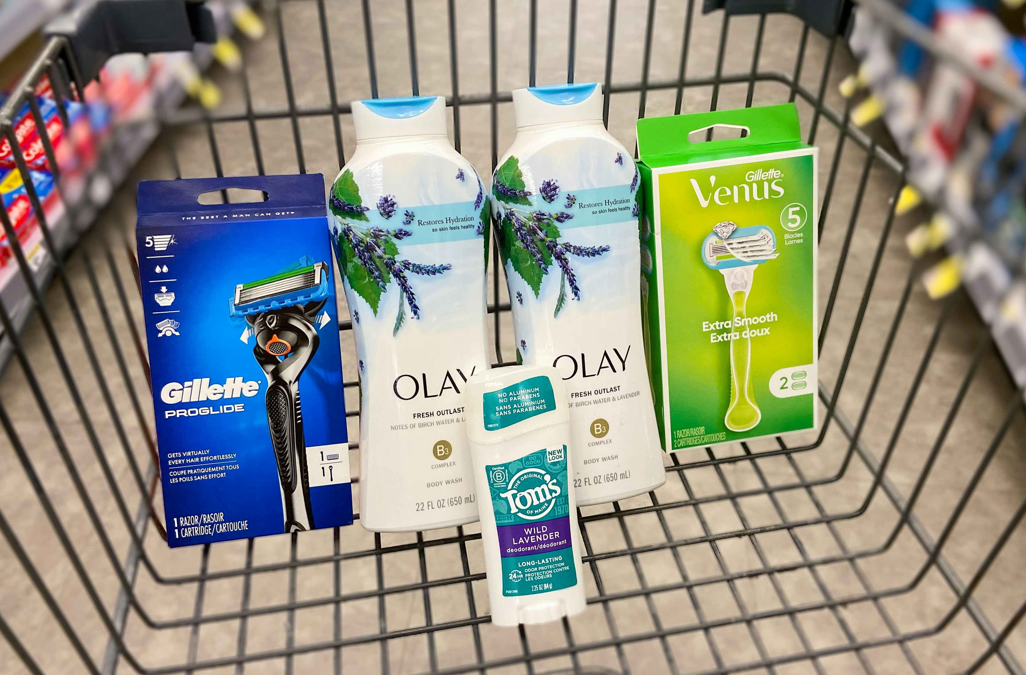 a walgreens cart with olay body wash, gillette and venus razors, and tom's deodorant