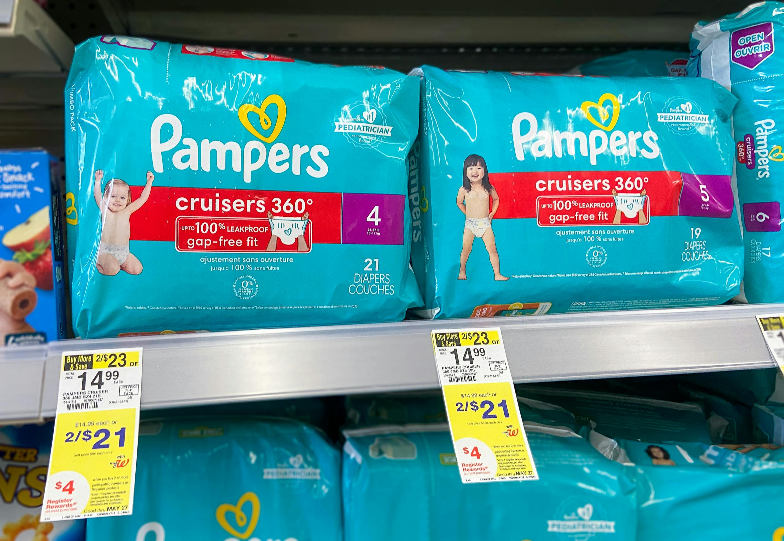 Pampers diaper packages on shelf with Walgreens sales tags