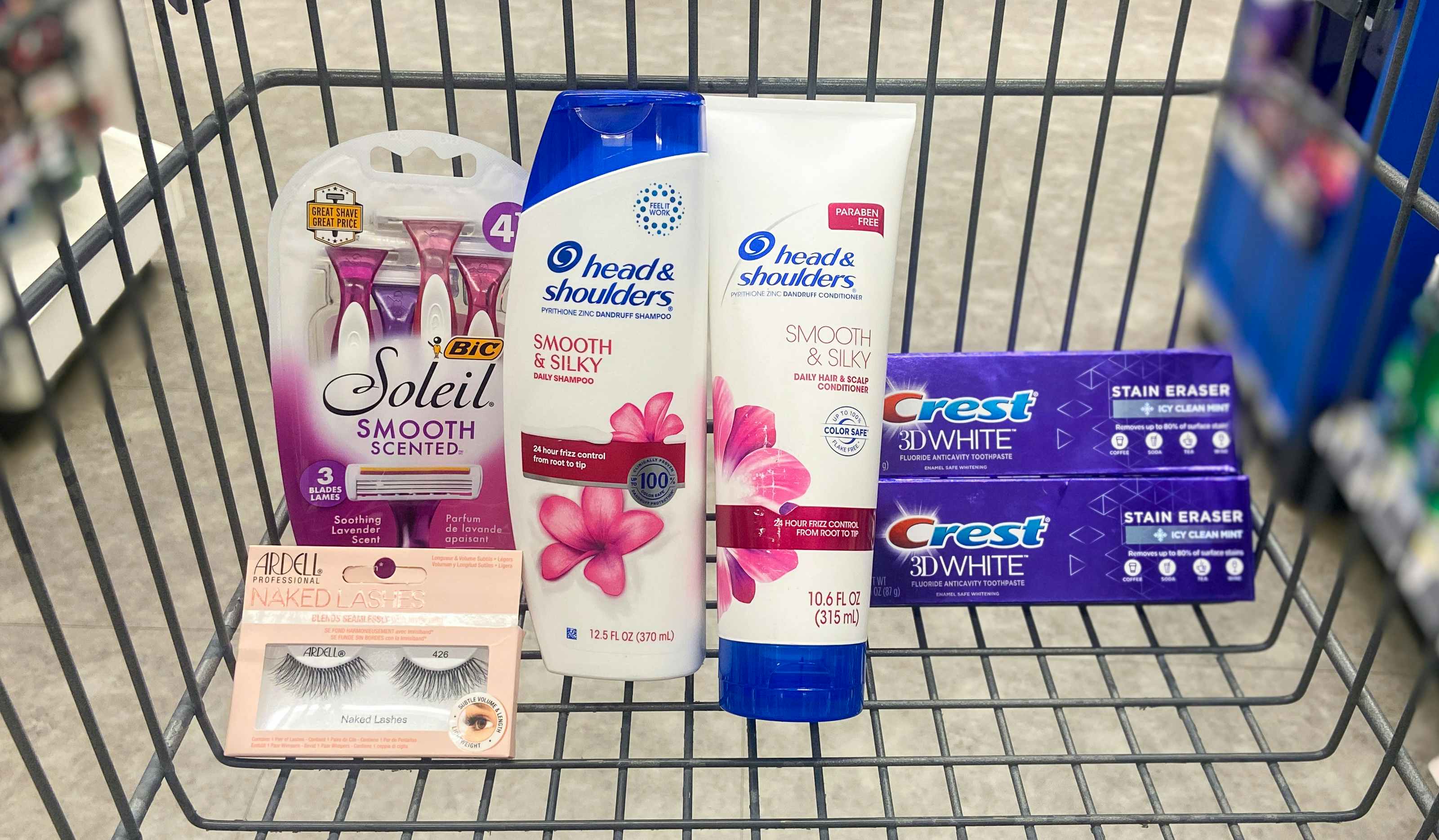 walgreens cart with head & shoulders shampoo, crest toothpaste, bic razors, and ardell false lashes