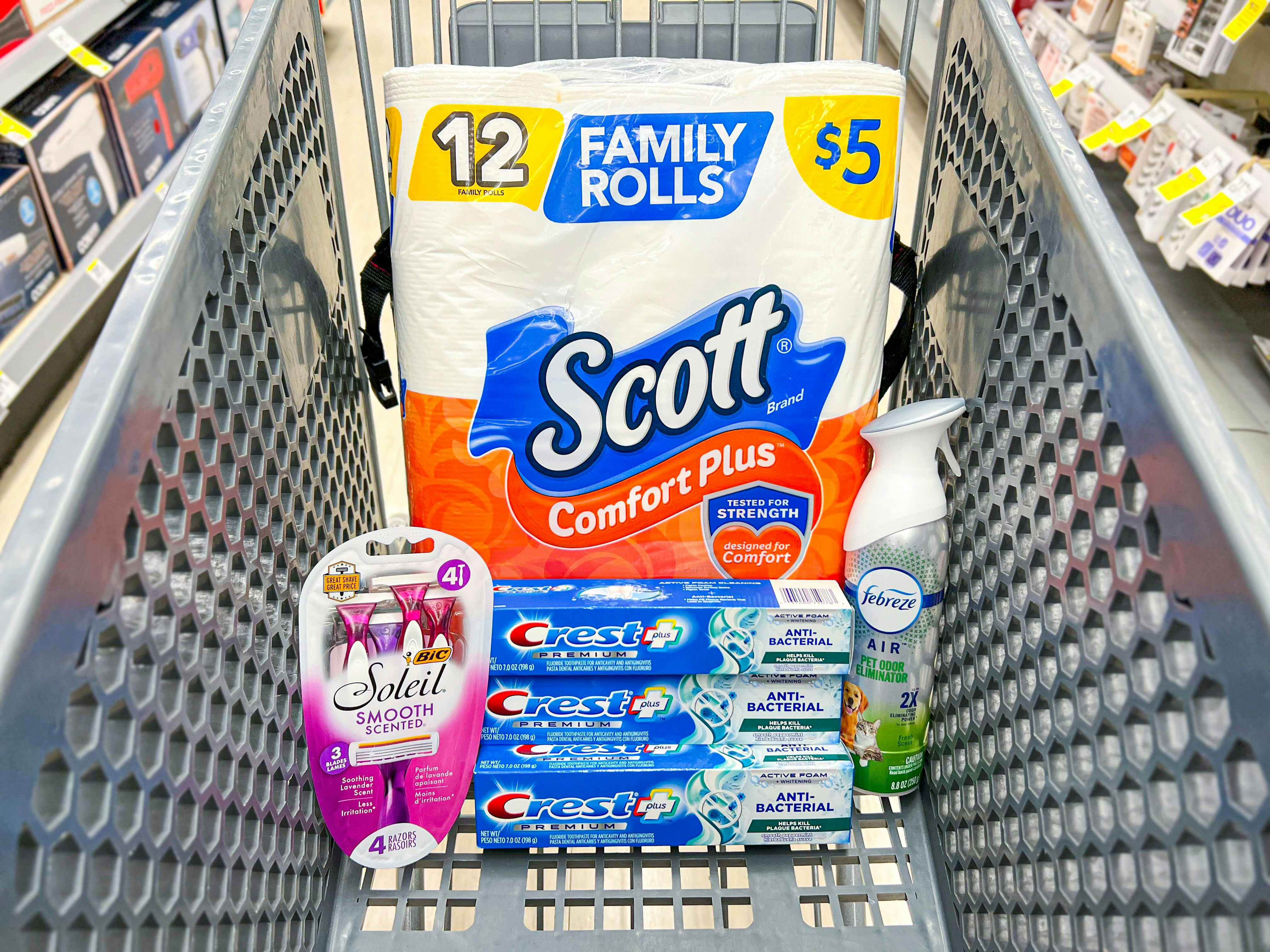 walgreens shopping cart with crest toothpaste, scott toilet paper, febreze, and bic razors
